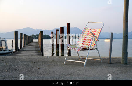 lonely landing stage with mountain at background Stock Photo