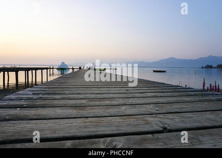 lonely landing stage with mountain at background Stock Photo - Alamy