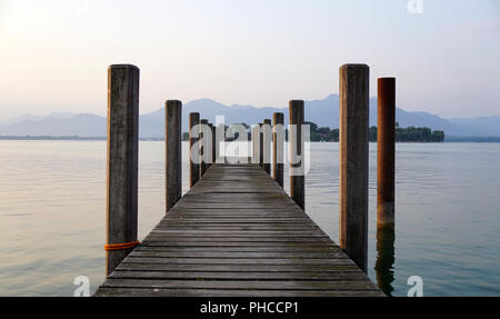 lonely landing stage with mountain at background Stock Photo