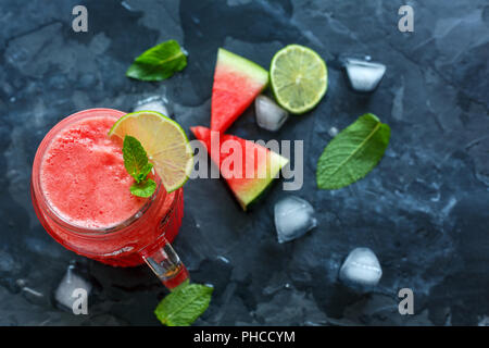 Icy watermelon smoothie in a glass jar. Stock Photo