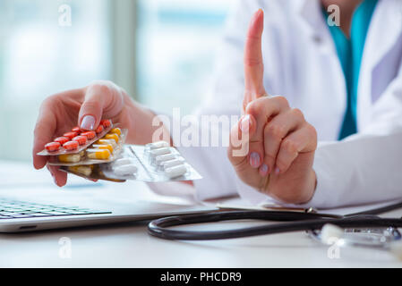 Doctor with prescribed medicines in medical concept Stock Photo