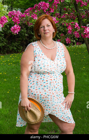 middle age woman in summer dress Stock Photo