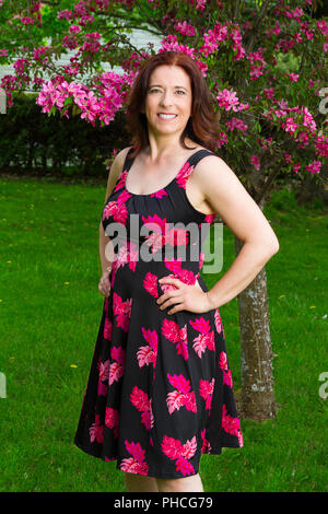 Woman under a cherry tree Stock Photo