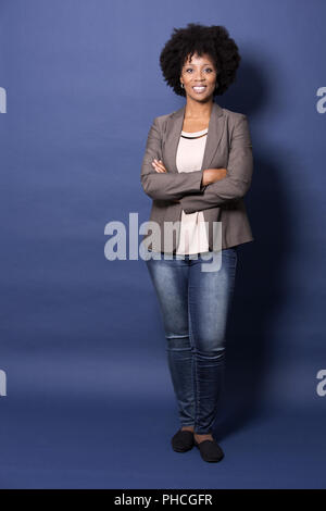 black casual woman on blue background Stock Photo