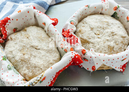 Dough in proofing basket. Stock Photo