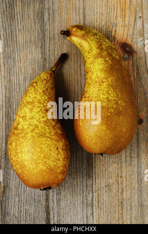 two fresh pears on a wooden background Stock Photo