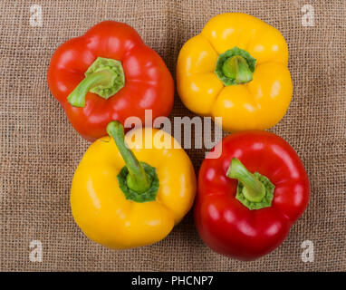 Colorful bell Paprika pepper photographed on a Jute fabric Stock Photo