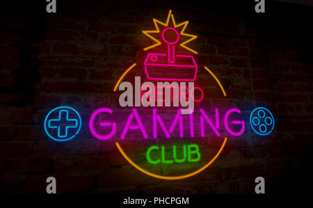 Gaming retro club neon 3D illustration. Symbol and lettering on wall background. Vintage game sign concept. Stock Photo