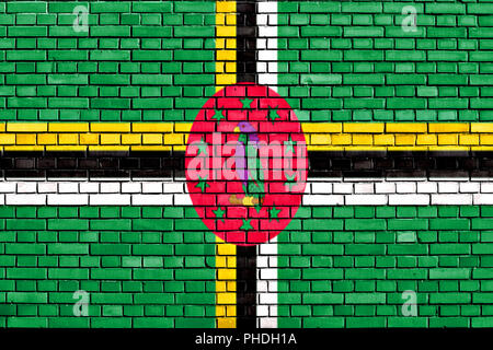 National flag of Dominica on a brick background. Concept image for ...