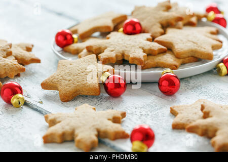Ginger cookies and red Christmas balls. Stock Photo