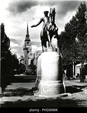 This photograph depicts a view of the Revere Statue with the Old North Church in the background. 1955 Stock Photo