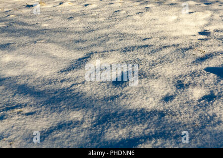 surface of the snow drifts during sunset, Photo close up in winter Stock Photo