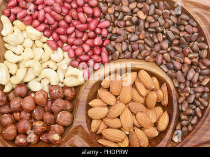 Nuts in wooden bowl Stock Photo