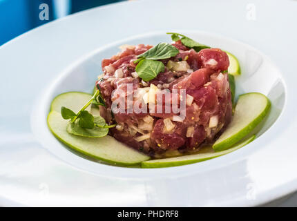 A plate of delicious tuna tartare with green apple Stock Photo