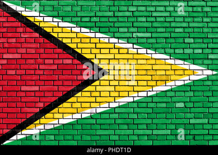 flag of Guyana painted on brick wall Stock Photo