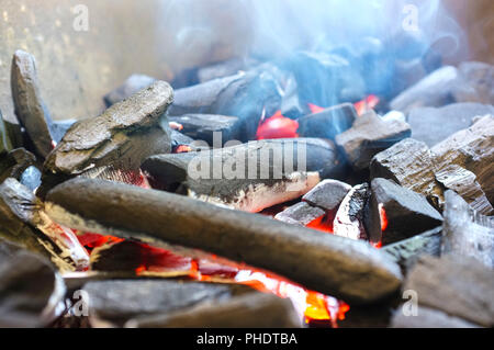 Burning charcoal with smoke Stock Photo