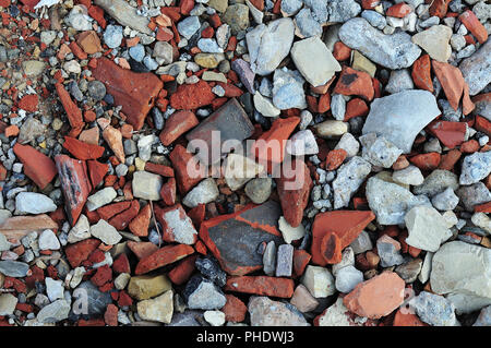 floor at construction site, covered with rubble, gravel and crushed tiles Stock Photo