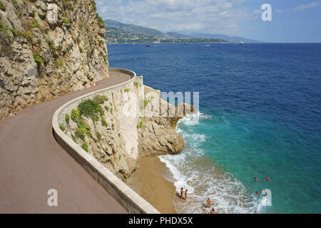 AERIAL VIEW from a 6-meter mast. Small unspoiled beach in a hidden cove in the densely populated city / country of Monaco. Stock Photo