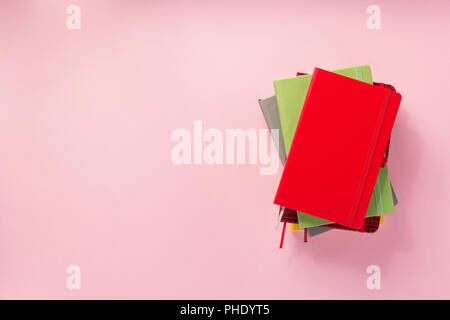 notebook and school accessories at abstract background surface Stock Photo
