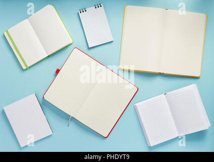 notebook and school accessories at abstract background surface Stock Photo