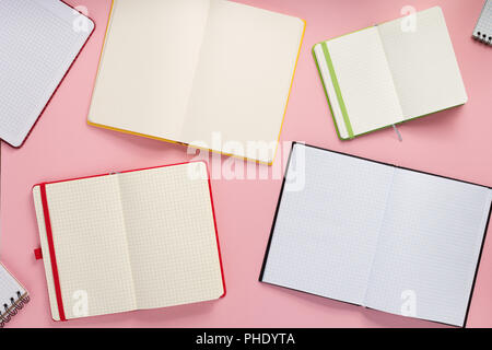 notebook and school accessories at abstract background surface Stock Photo