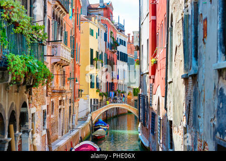 Small canal between houses in Venice Stock Photo