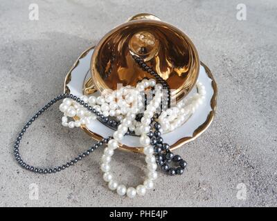 Pearls in golden cup Stock Photo