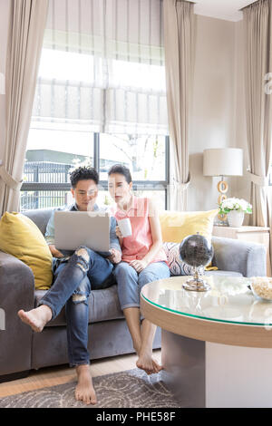 Young Couples using laptop Stock Photo