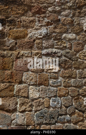 Old rough stone wall, background wallpaper Stock Photo - Alamy