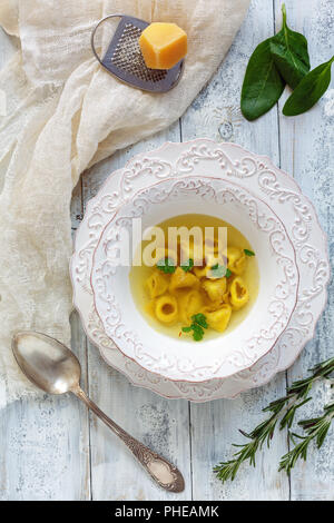 Tortellini in broth. Traditional Italian cuisine. Stock Photo