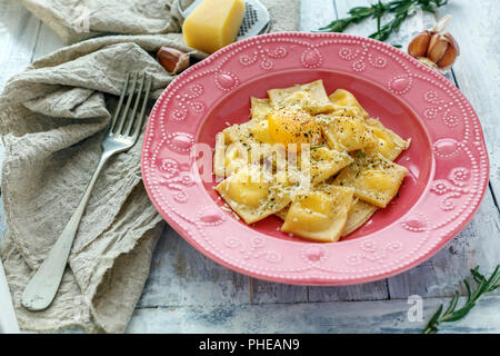 Ravioli with ricotta and Parmesan cheese in a plate. Stock Photo