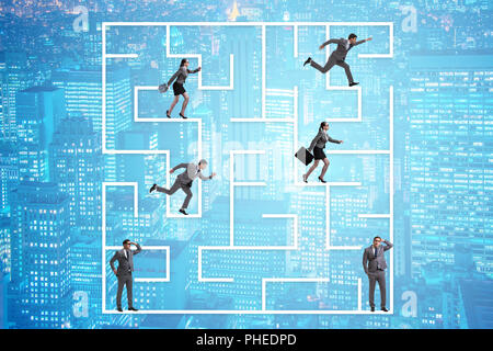 Business people getting lost in maze uncertainty concept Stock Photo