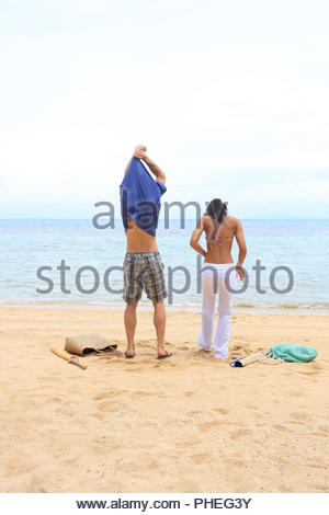 Woman undressing on beach Stock Photo: 138502912 - Alamy