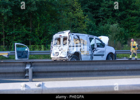Slovenian Post Van damaged in car accident on Styrian Highway A1 near Blagovica, Fireman walking toward the vehicle. The A1 is one of busiest highways in Slovenia. Stock Photo