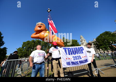 An inflated blimp of London mayor Sadiq Khan depicted in a bikini prepares to be launched over Parliament Square, Westminster in London, as part of a campaign seeking to remove Mr Khan from his post. Stock Photo