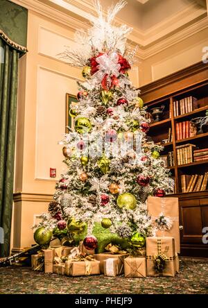 decorated christmas tree in modern living room or office lobby Stock Photo