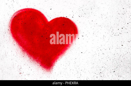 Red heart on concrete wall Stock Photo