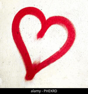 Red heart on concrete wall Stock Photo