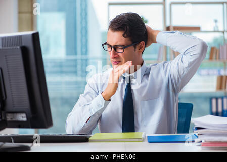 Businessman suffering from excessive armpit sweating Stock Photo