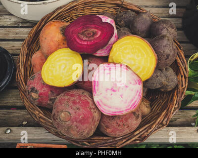 top down view on a basket of sliced root vegetables Stock Photo