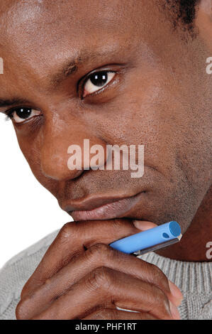 Close up portrait of African man looking thoughtful Stock Photo