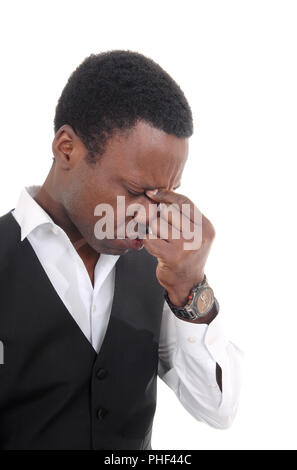 Depressed African man with hand on face Stock Photo