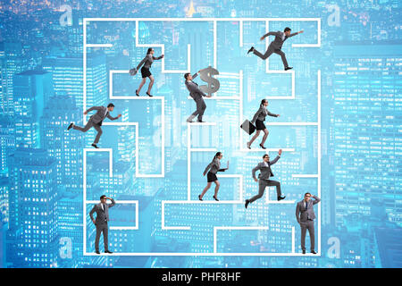 Business people getting lost in maze uncertainty concept Stock Photo