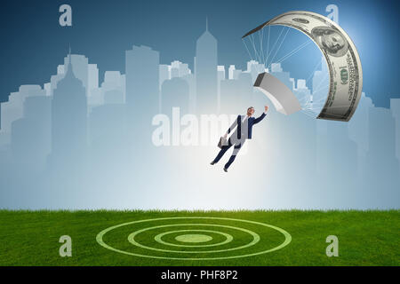 Businessman in golden parachute concept Stock Photo