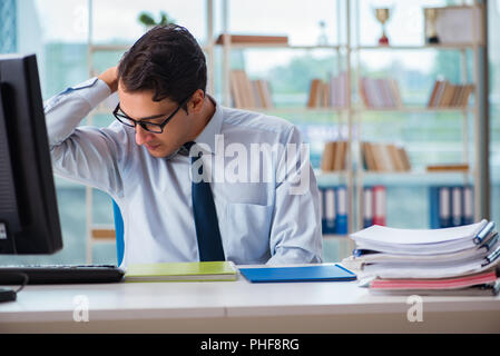 Businessman suffering from excessive armpit sweating Stock Photo