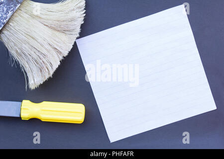 working tools on a dark background with white lettering paper Stock Photo
