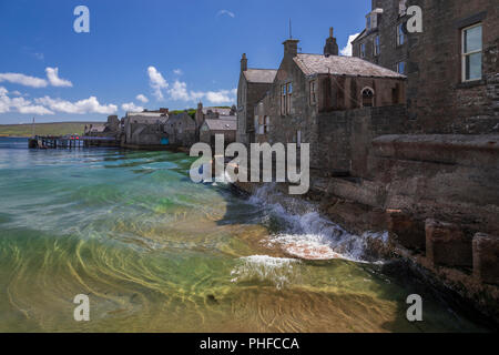 Old stone houses by the sea at Lerwick, Shetland Isles, Scotland on a sunny day Stock Photo