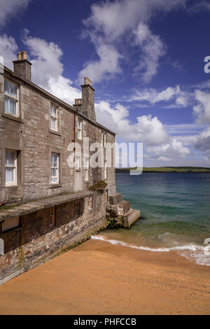 Old stone house by the sea at Lerwick, Shetland Isles, Scotland on a sunny day Stock Photo