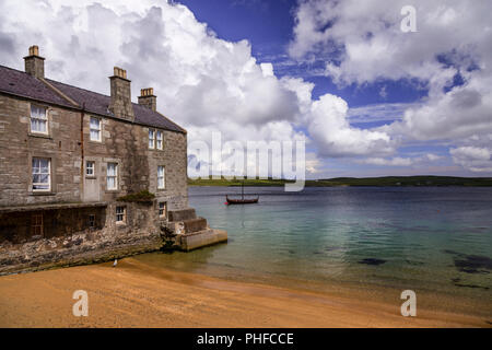 Old stone house by the sea at Lerwick, Shetland Isles, Scotland on a sunny day Stock Photo