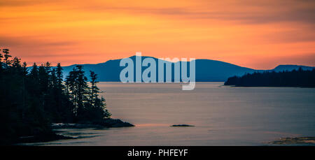 sunset over alaska fjords on a cruise trip near ketchikan Stock Photo